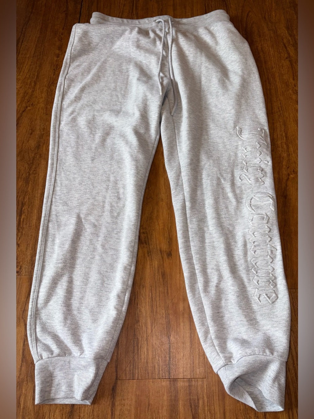 Grey juicy sweatpants raised lettering medium